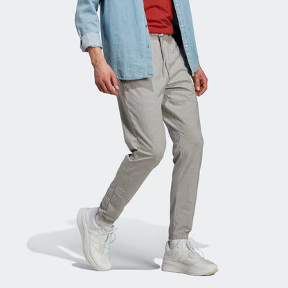 Men's adidas Essentials Single Jersey Tapered Badge of Sport Pants