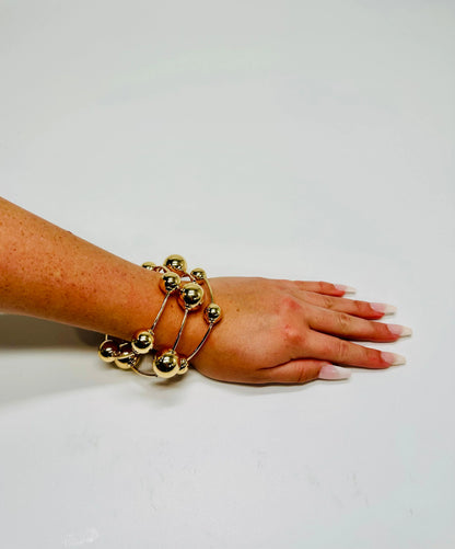 Orbital Flow Gold Cuff Bracelet with Sculptural Orbs