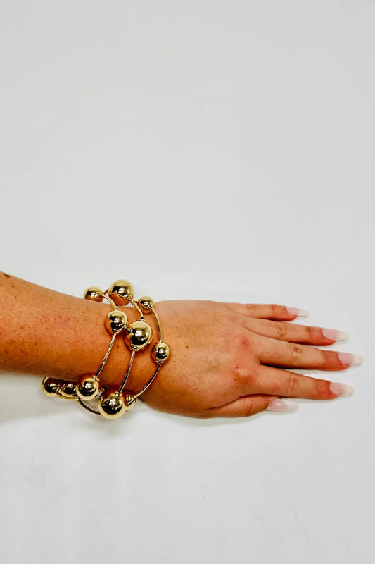 Orbital Flow Gold Cuff Bracelet with Sculptural Orbs